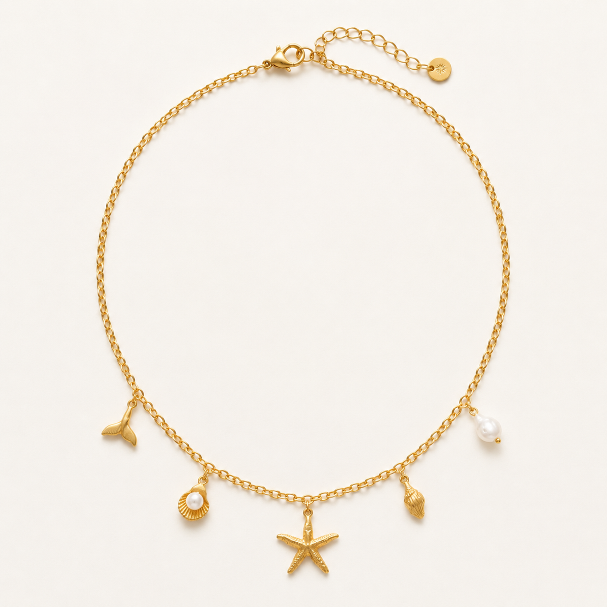 Collier Bora Bora Merveilleuse Bijoux, chaîne fine dorée breloques marines étoile de mer queue de baleine coquillage perle baroque
